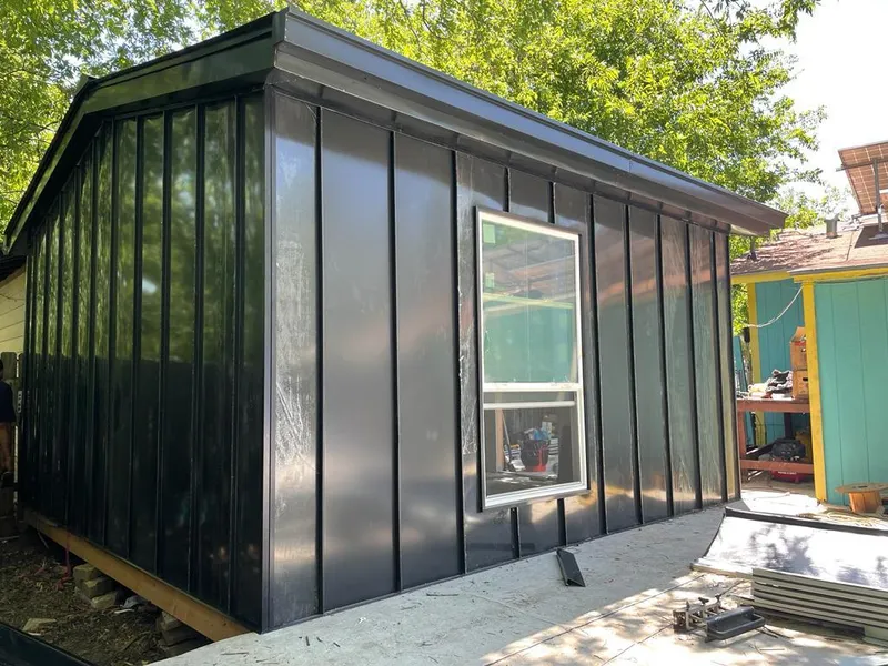Black standing seam metal wall panels for Metal Roof Installation in Hickam Housing