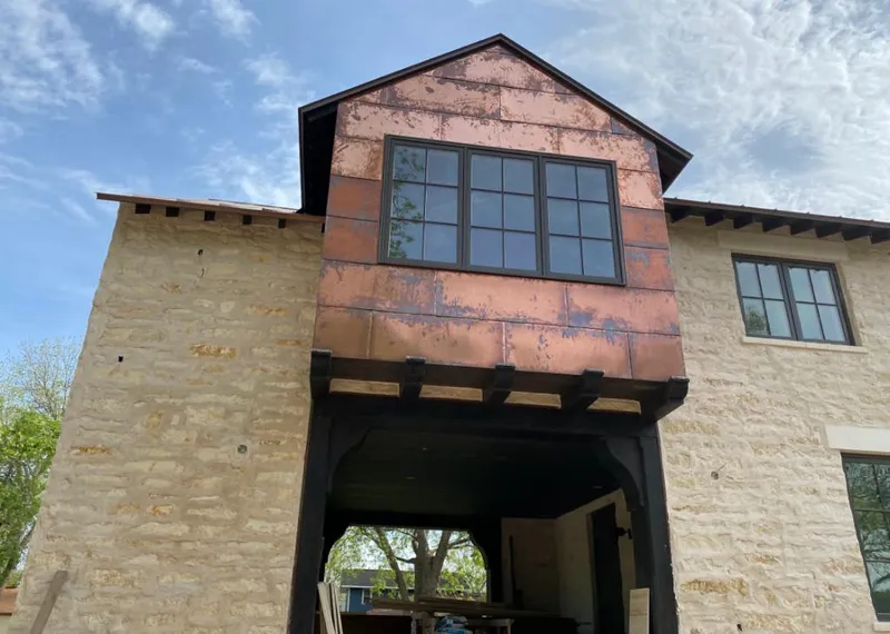 Copper metal panel facade on a stone building for Metal Roof Coating in Hickam Housing